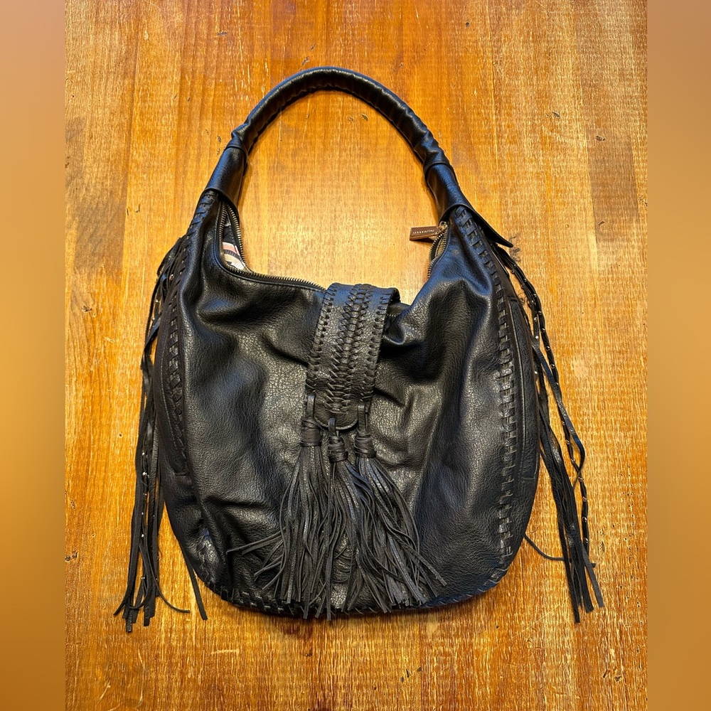 Conceal carry shoulder bag with fringe.